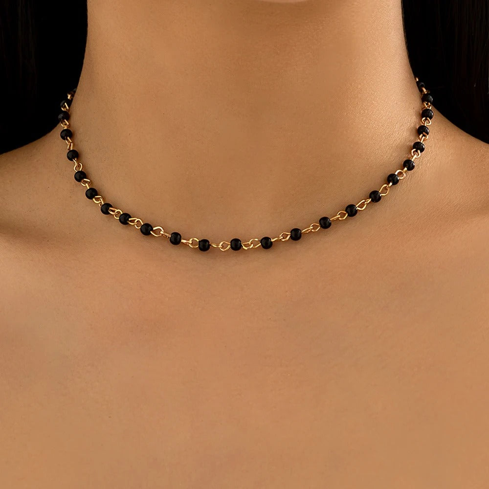 Person Wearing Bead Necklace Women in Black