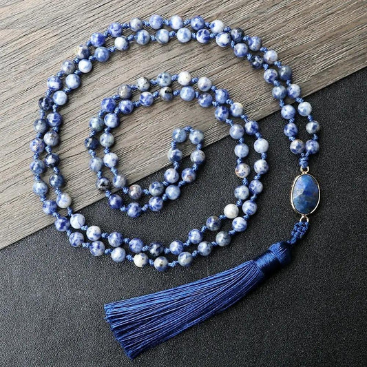 Blue and White Bead Necklace on a gray wooden background