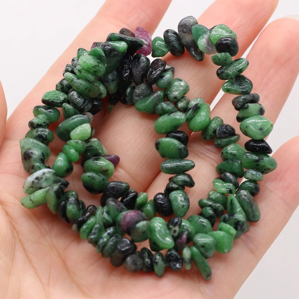 Person Holding Emerald Beads Necklace