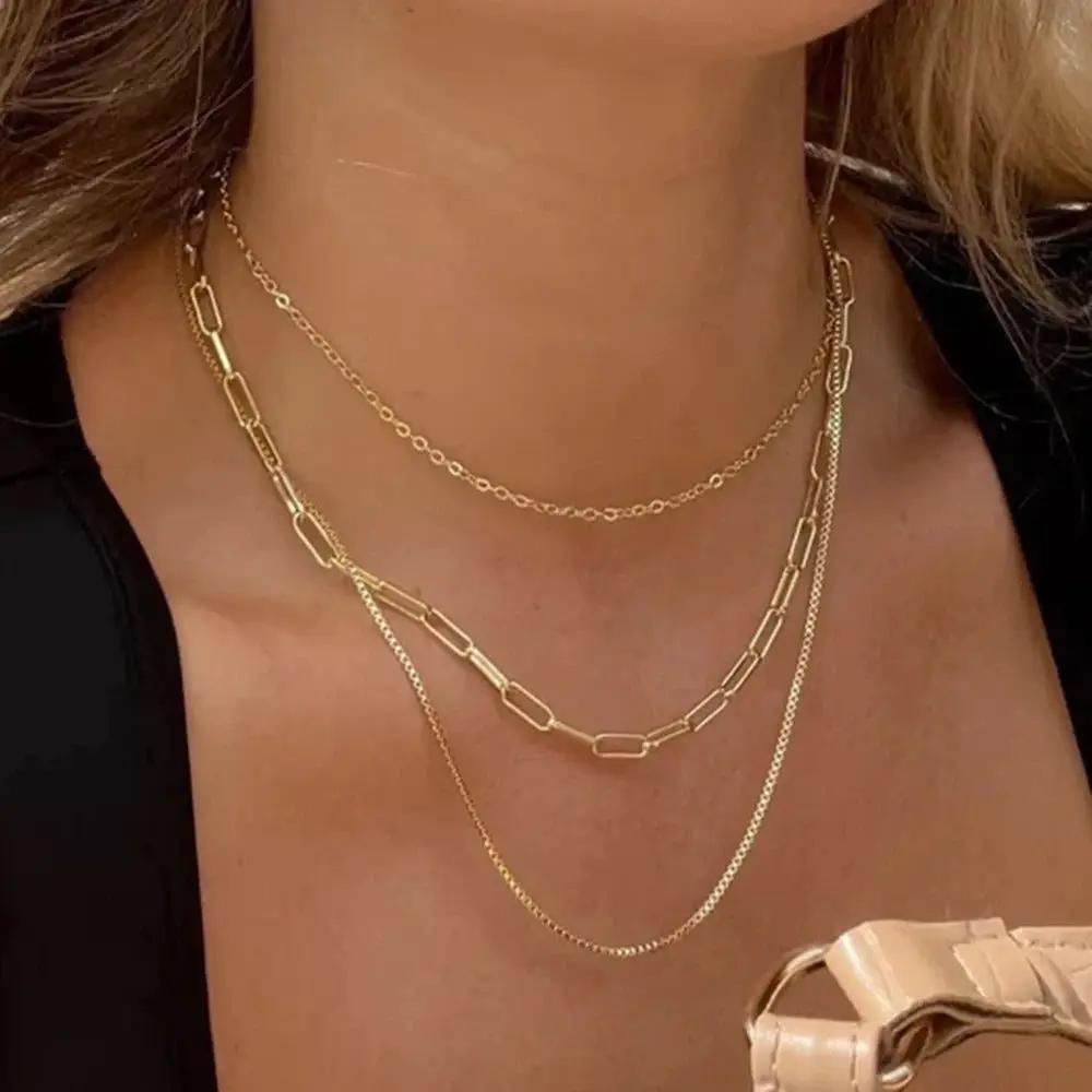Blonde-brunette woman wearing Gold Layered Necklaces
