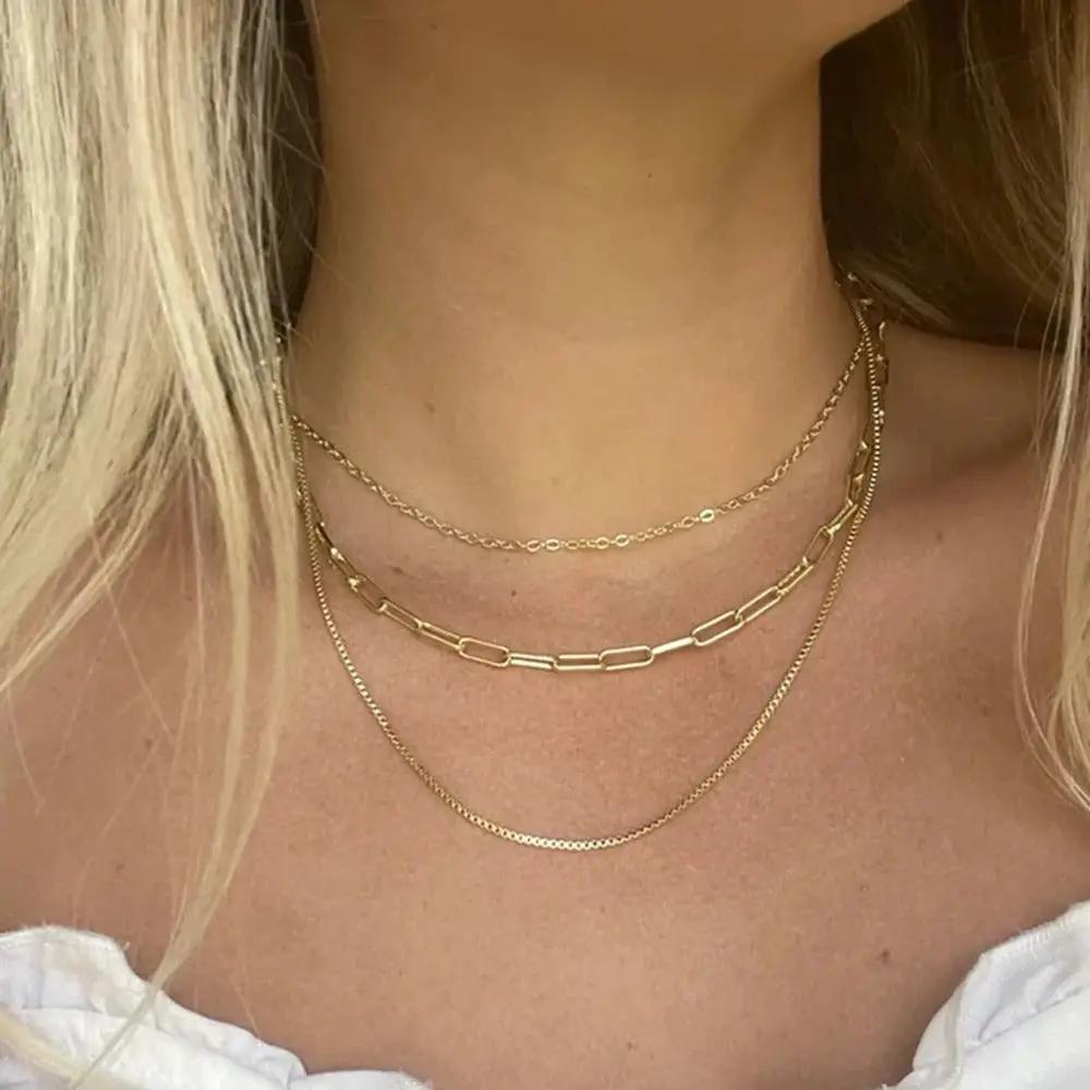 Blonde woman wearing Gold Layered Necklaces