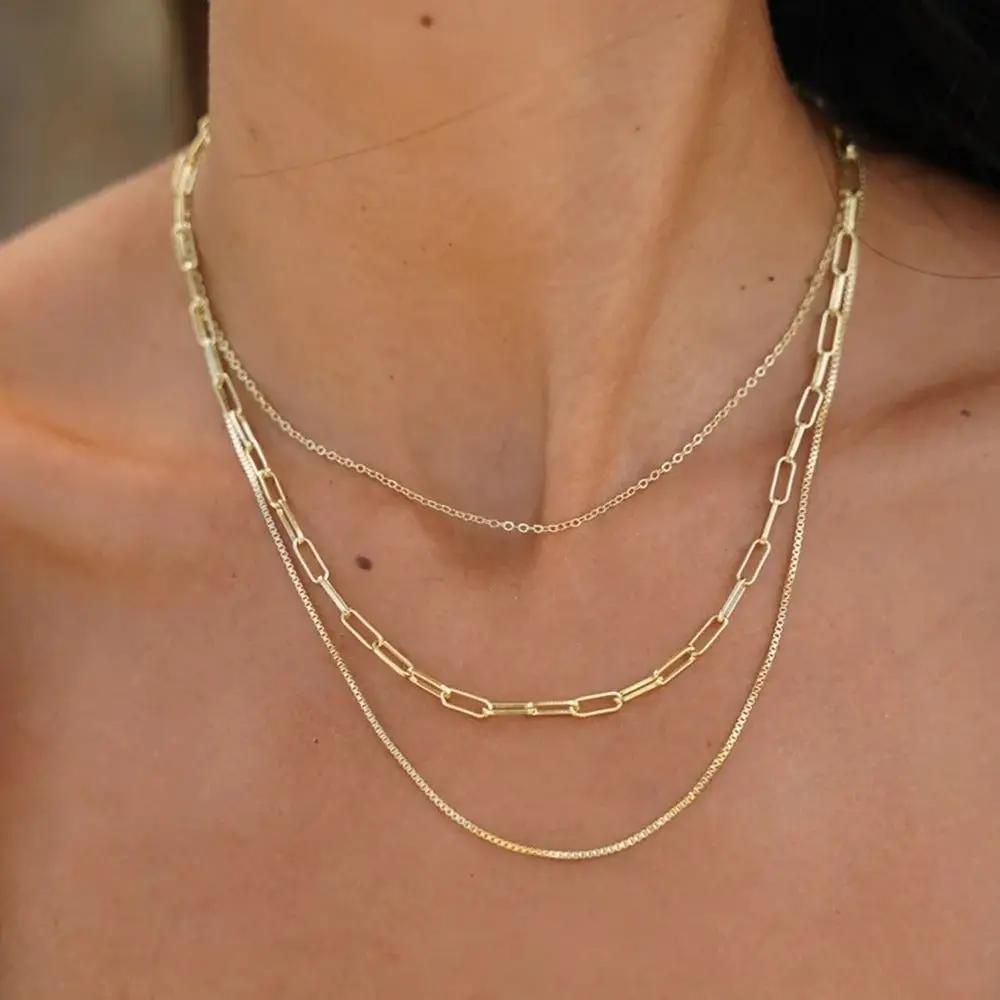 Woman wearing Gold Layered Necklaces