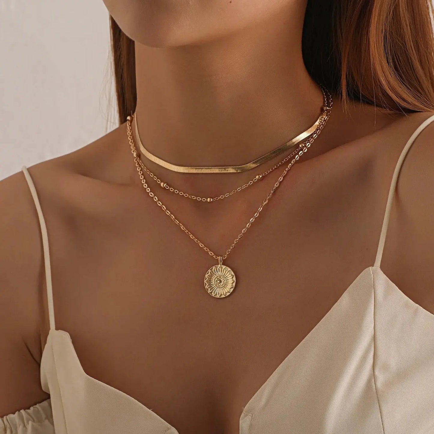 Side facing brunette woman wearing Layered Pendant Necklace