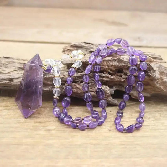Purple Gemstone Necklace standing next to decorative piece of wood
